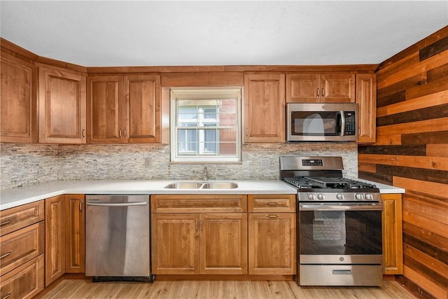 533 Freeport Rd, New Kensington, PA 15068 - kitchen with stainless steel appliances, a sink, brown cabinetry, and decorative backsplash