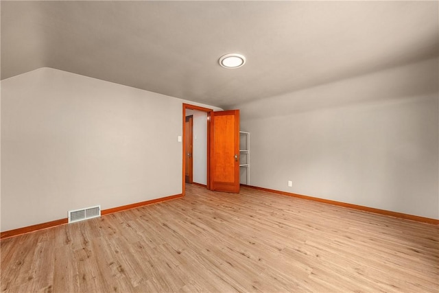 533 Freeport Rd, New Kensington, PA 15068 - empty room featuring light wood finished floors, baseboards, and lofted ceiling