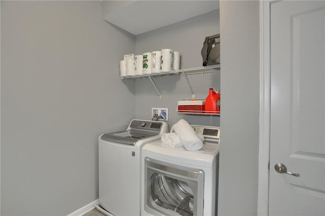 laundry room with washing machine and clothes dryer