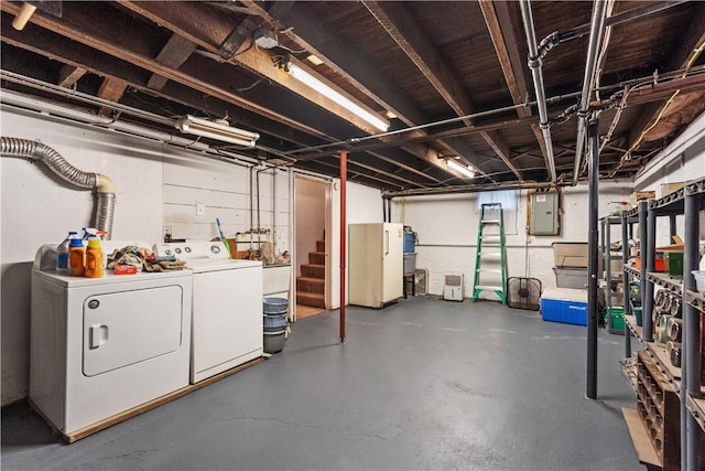 unfinished below grade area with washer and dryer and electric panel