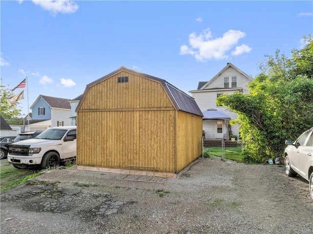 view of shed with fence