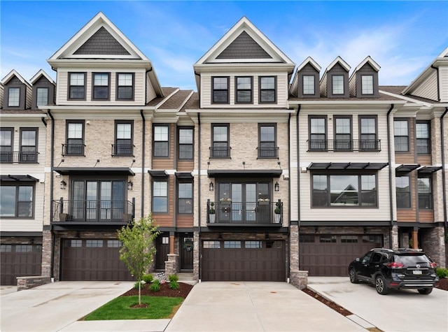 multi unit property with a garage and driveway