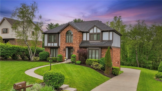 304 Diana Dr, Robinson Twp Nwa, PA 15136 - tudor home featuring brick siding, a front lawn, and roof with shingles