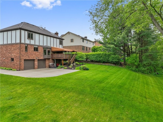 304 Diana Dr, Robinson Twp Nwa, PA 15136 - back of house featuring stairs, a wooden deck, brick siding, a lawn, and an attached garage