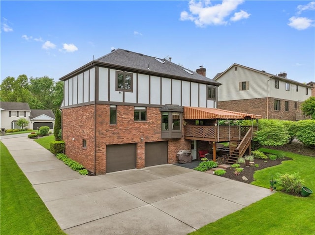 304 Diana Dr, Robinson Twp Nwa, PA 15136 - back of house featuring brick siding, a garage, concrete driveway, a wooden deck, and stairs