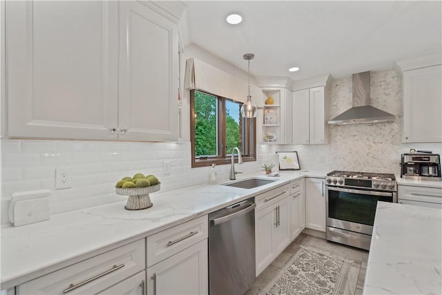 304 Diana Dr, Robinson Twp Nwa, PA 15136 - kitchen with wall chimney range hood, stainless steel appliances, a sink, white cabinetry, and decorative backsplash