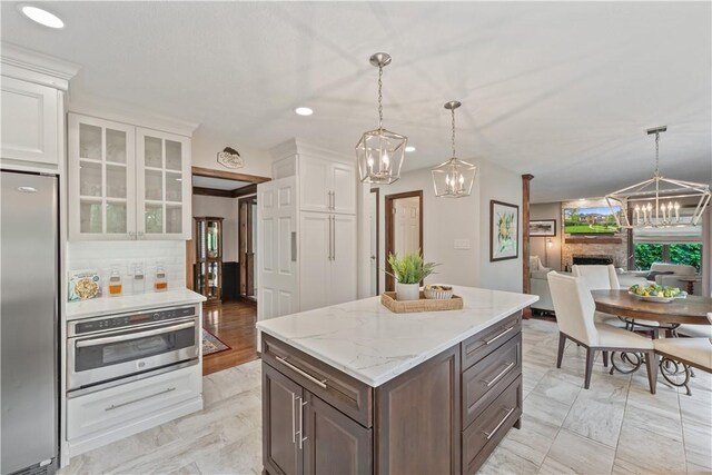 304 Diana Dr, Robinson Twp Nwa, PA 15136 - kitchen with stainless steel appliances, a chandelier, white cabinetry, glass insert cabinets, and recessed lighting