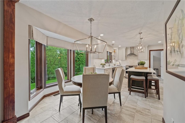 304 Diana Dr, Robinson Twp Nwa, PA 15136 - dining room featuring a chandelier, light marble finish floors, recessed lighting, a textured ceiling, and baseboards