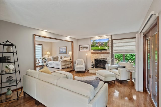 304 Diana Dr, Robinson Twp Nwa, PA 15136 - living room featuring a stone fireplace and wood finished floors