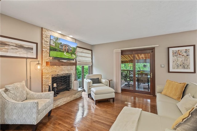 304 Diana Dr, Robinson Twp Nwa, PA 15136 - living room with wood finished floors, a stone fireplace, and recessed lighting