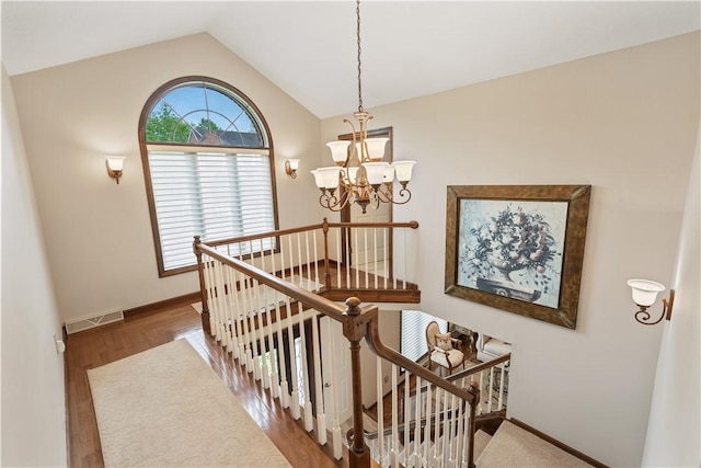 304 Diana Dr, Robinson Twp Nwa, PA 15136 - stairway with a chandelier, vaulted ceiling, wood finished floors, and baseboards