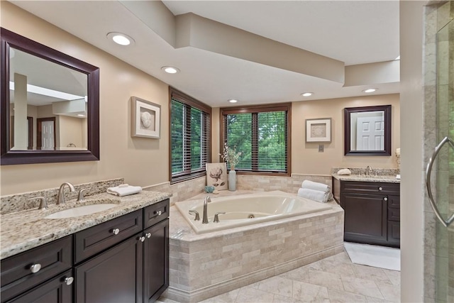 304 Diana Dr, Robinson Twp Nwa, PA 15136 - bathroom featuring a whirlpool tub, two vanities, a stall shower, and recessed lighting