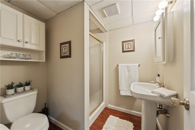 304 Diana Dr, Robinson Twp Nwa, PA 15136 - full bathroom featuring a paneled ceiling, a shower stall, toilet, wood finished floors, and baseboards