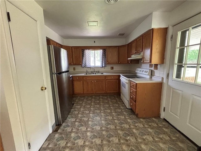 6103 Brownsville Rd, South Park, PA 15236 - kitchen featuring electric stove, freestanding refrigerator, a sink, under cabinet range hood, and light countertops