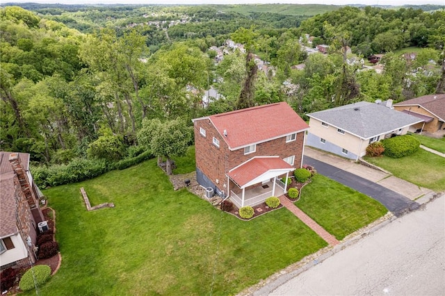 drone / aerial view of a heavily wooded area