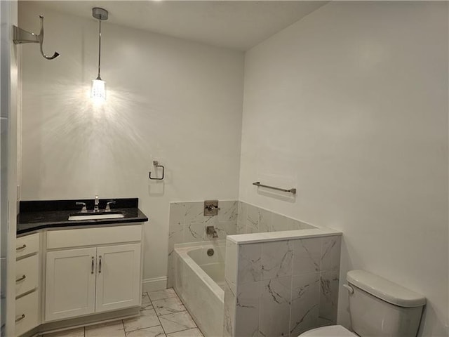 801 Wimbledon Dr, Mount Pleasant Twp Wml, PA 15666 - bathroom with toilet, a garden tub, marble look tiles, and vanity