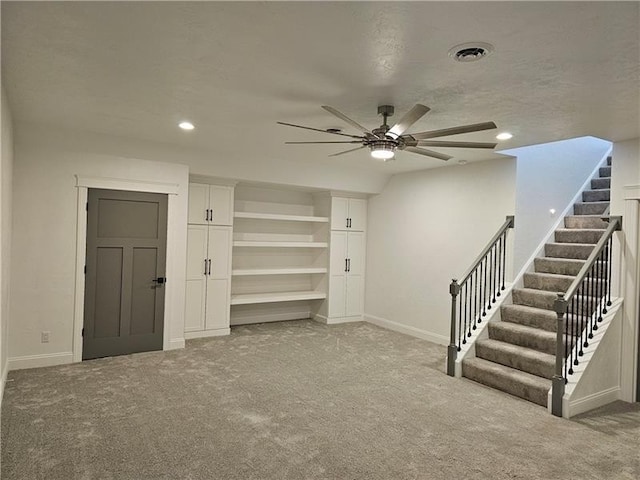 interior space featuring stairway, a ceiling fan, carpet, baseboards, and recessed lighting