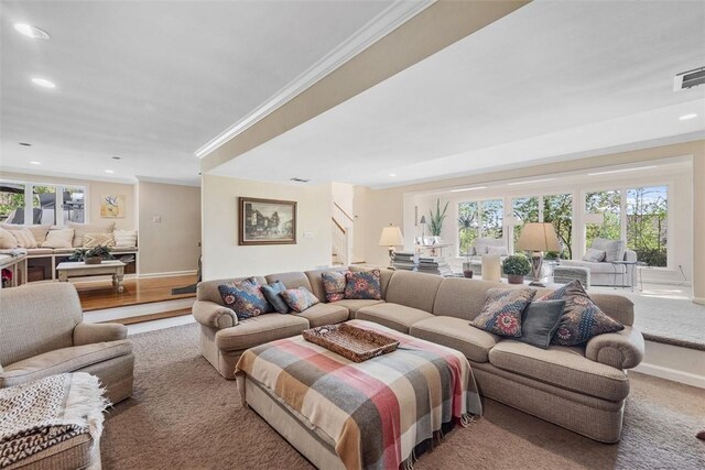 living area featuring stairway, crown molding, recessed lighting, and baseboards