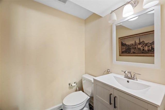 bathroom featuring toilet and vanity
