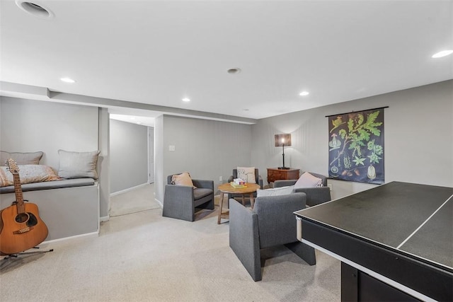 living area featuring light carpet, recessed lighting, and baseboards
