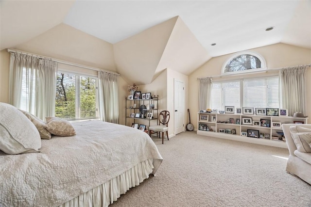 bedroom featuring vaulted ceiling and light colored carpet