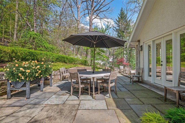 view of patio / terrace featuring outdoor dining space and french doors