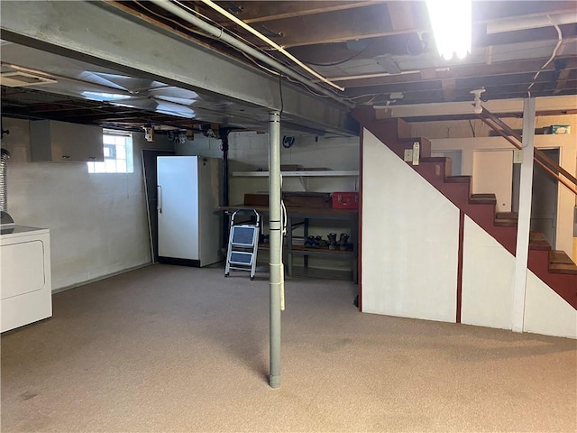616 River Ridge Rd, Liberty Boro, PA 15133 - basement featuring freestanding refrigerator, washer / dryer, stairs, and carpet flooring