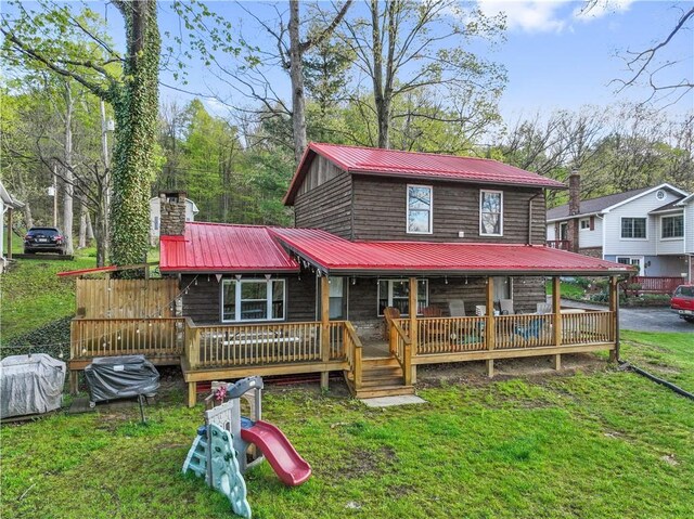 1036 Causeway Dr, Lake Stonycreek, PA 15541 - view of front of property featuring metal roof, a front yard, and a chimney