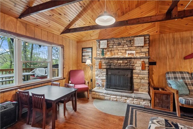 1036 Causeway Dr, Lake Stonycreek, PA 15541 - living area with wood walls, wood finished floors, wooden ceiling, and a stone fireplace