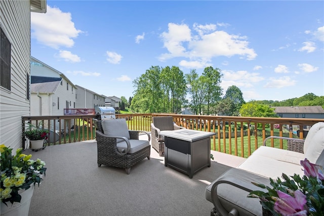 view of patio featuring a wooden deck and a residential view