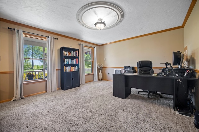 home office with a textured ceiling, carpet, ornamental molding, and baseboards