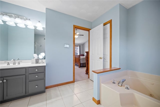 full bathroom with baseboards, connected bathroom, a garden tub, and vanity