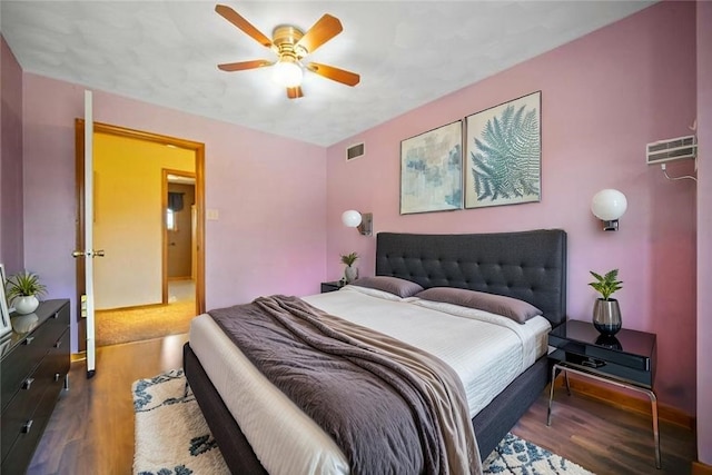 bedroom with wood finished floors and ceiling fan
