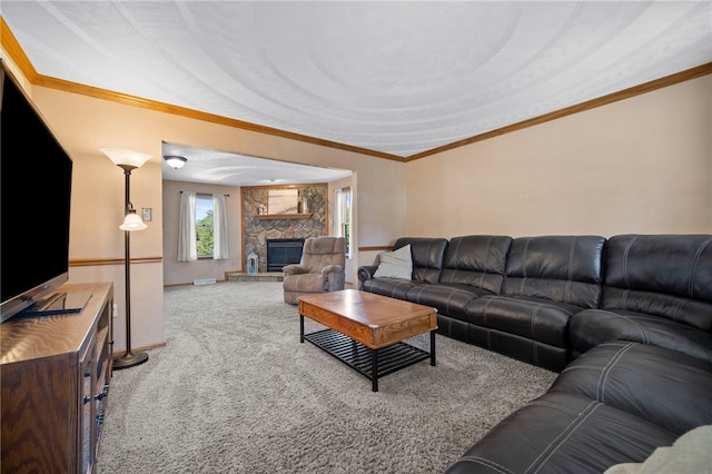 living area with carpet flooring, a stone fireplace, crown molding, and baseboards