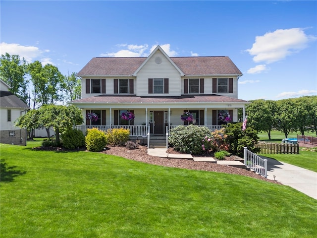 view of front of house with a porch and a front yard