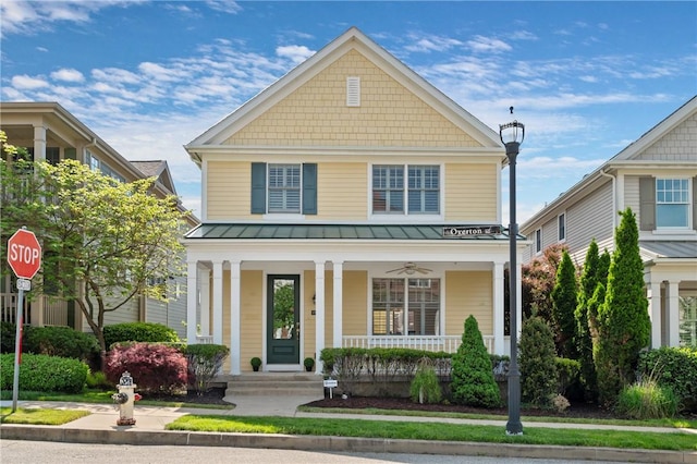 view of front of home featuring a porch, a standing seam roof, and metal roof