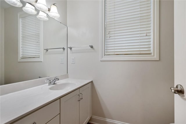 bathroom featuring a chandelier and vanity