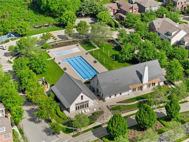 aerial perspective of suburban area featuring a pool area