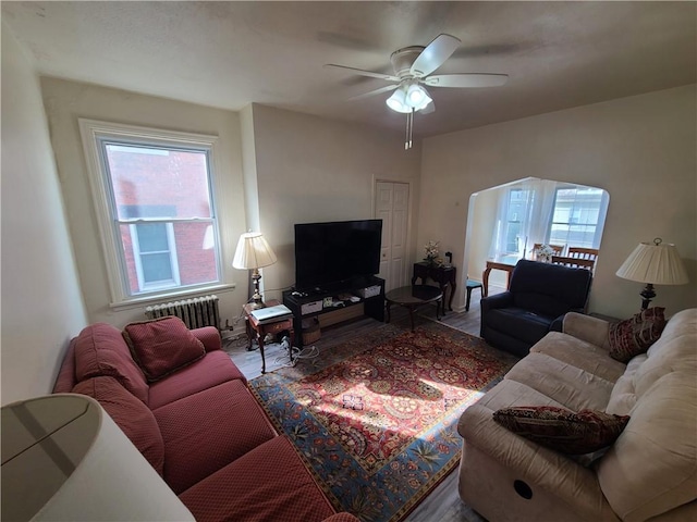 743 Taylor Ave, Avalon, PA 15202 - living room featuring radiator, wood finished floors, and healthy amount of natural light