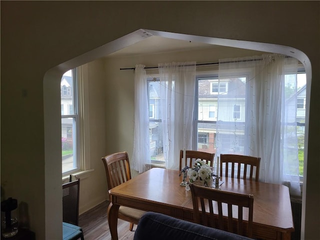 743 Taylor Ave, Avalon, PA 15202 - dining room featuring arched walkways, baseboards, and wood finished floors