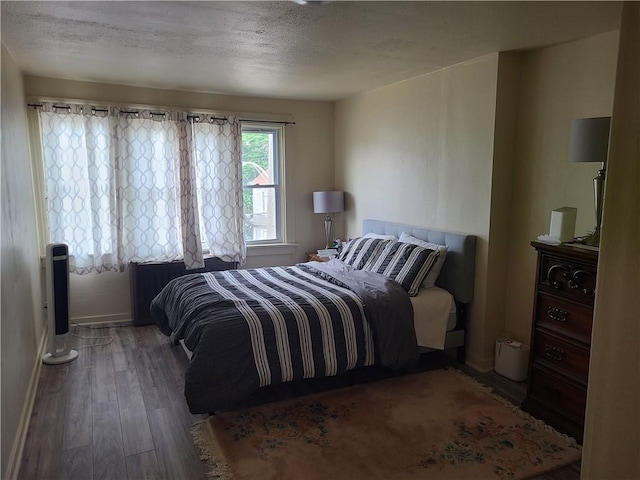 743 Taylor Ave, Avalon, PA 15202 - bedroom with wood finished floors, a textured ceiling, and baseboards