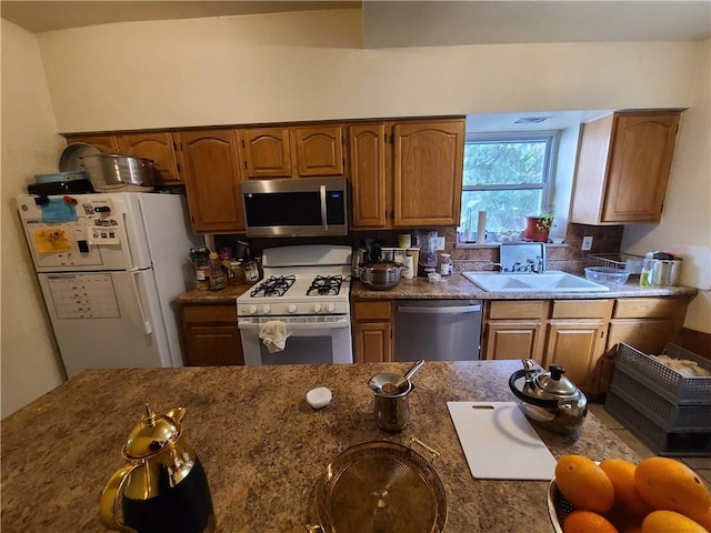743 Taylor Ave, Avalon, PA 15202 - kitchen featuring appliances with stainless steel finishes, a sink, and brown cabinetry