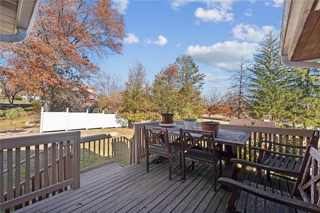 deck with outdoor dining area