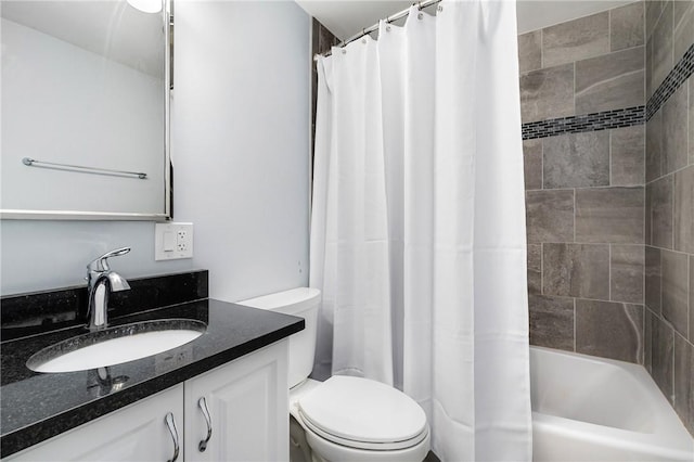 bathroom with toilet, vanity, and shower / bath combination with curtain