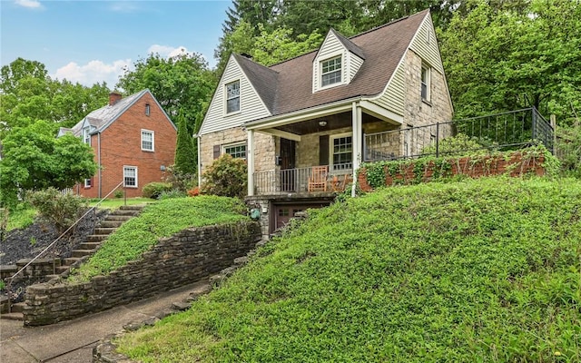 811 Jefferson Dr, Ross Twp, PA 15229 - cape cod house with stone siding, stairs, and a porch