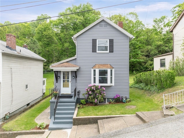 247 Pringle St, Banksville/Westwood, PA 15106 - traditional home with a front lawn and a chimney
