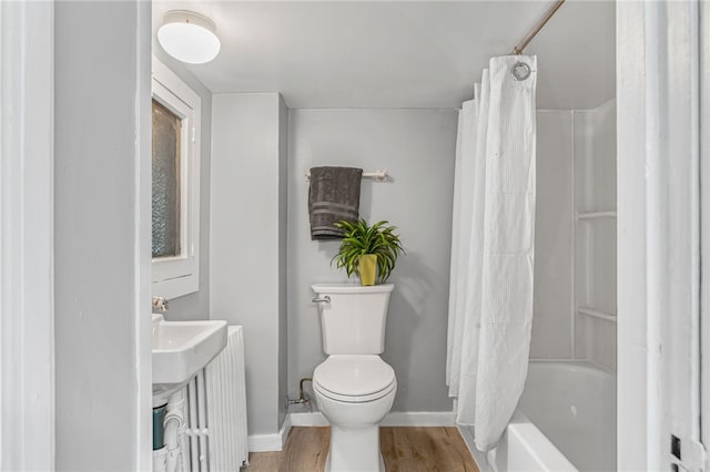247 Pringle St, Banksville/Westwood, PA 15106 - full bath with toilet, a sink, wood finished floors, baseboards, and shower / bath combo with shower curtain