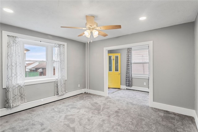 247 Pringle St, Banksville/Westwood, PA 15106 - carpeted spare room featuring a baseboard radiator, baseboards, plenty of natural light, ceiling fan, and recessed lighting
