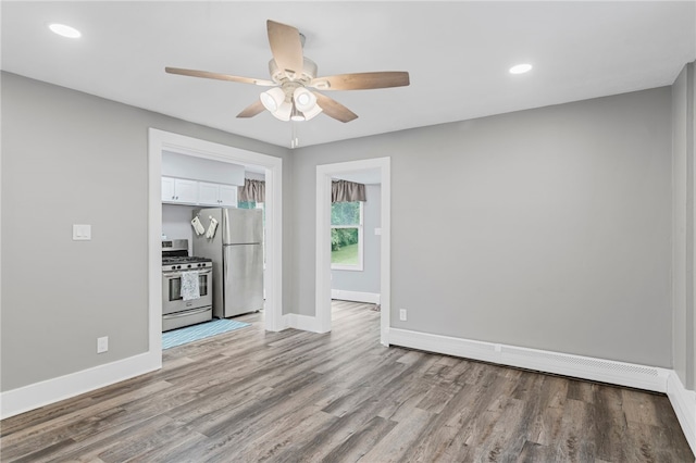 247 Pringle St, Banksville/Westwood, PA 15106 - unfurnished living room featuring a ceiling fan, wood finished floors, baseboards, and recessed lighting