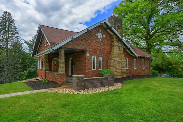 view of property exterior with a lawn, a chimney, and brick siding